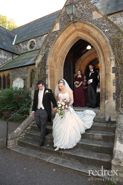 Married couple leaving church building