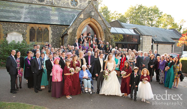 Large Fromal group shot, infront of Church