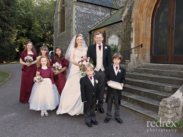 Bride with family, before wedding service, outside church