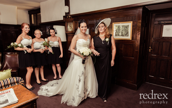 Bride with Mother and Bridesmaids before service at Whately Hall Hotel