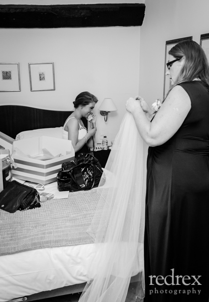 Family helping bride get ready
