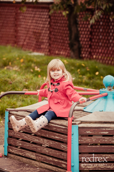 Toddler with football in the park