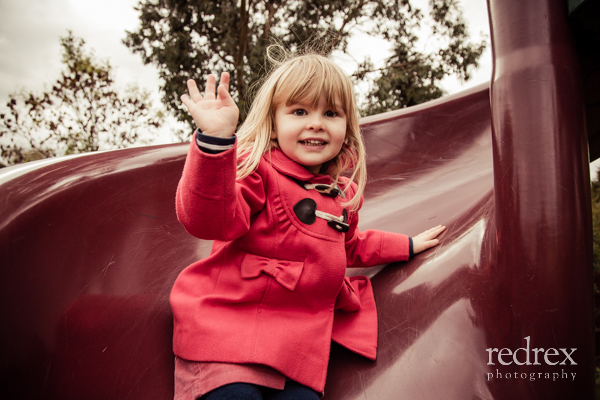 Toddler with football in the park